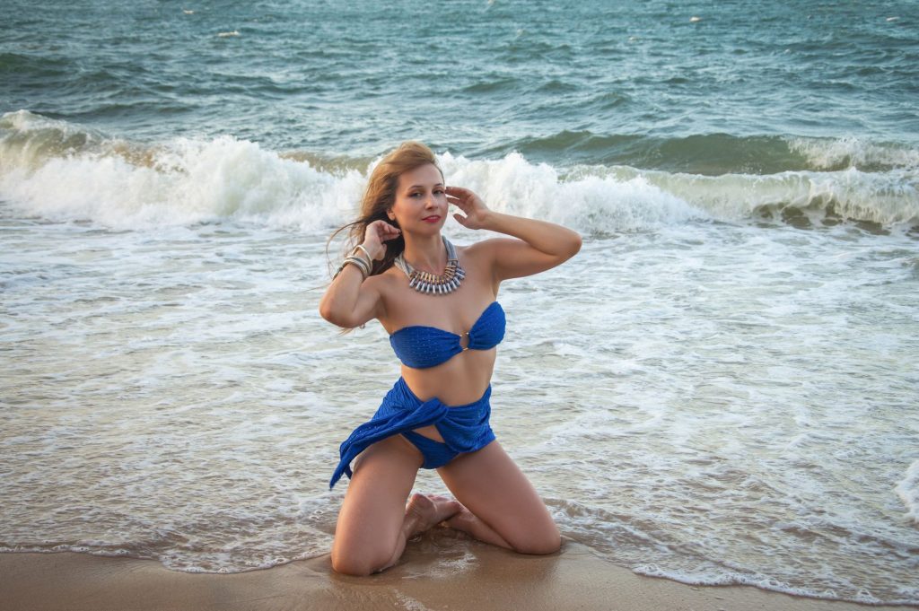 Woman in a bikini by the water